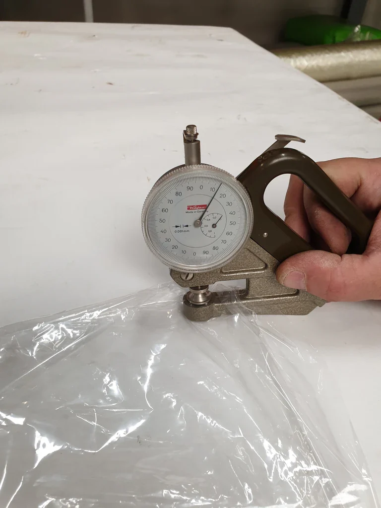 Measuring the thickness of laboratory blown film with a mechanical film gauge