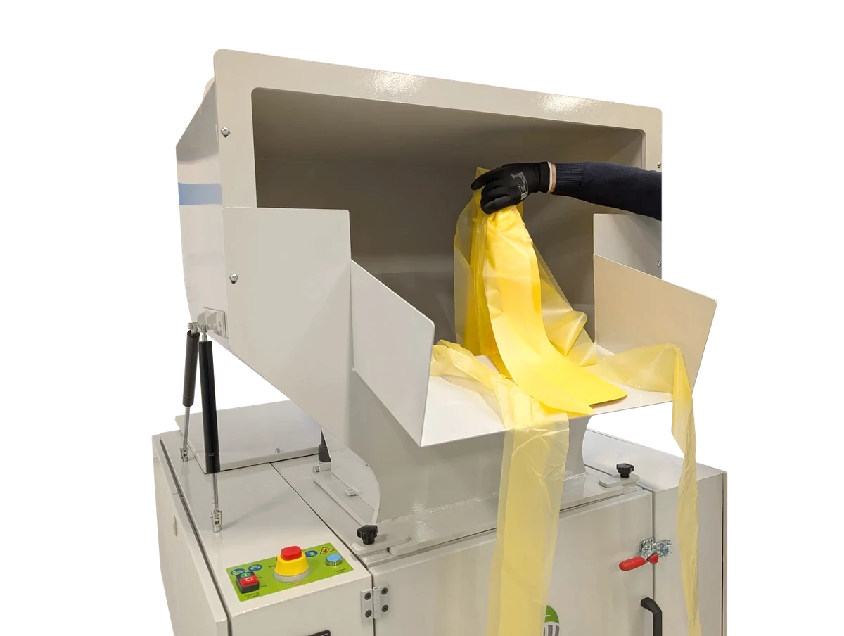 Manual feeding of film into the GRAN 1 granulator