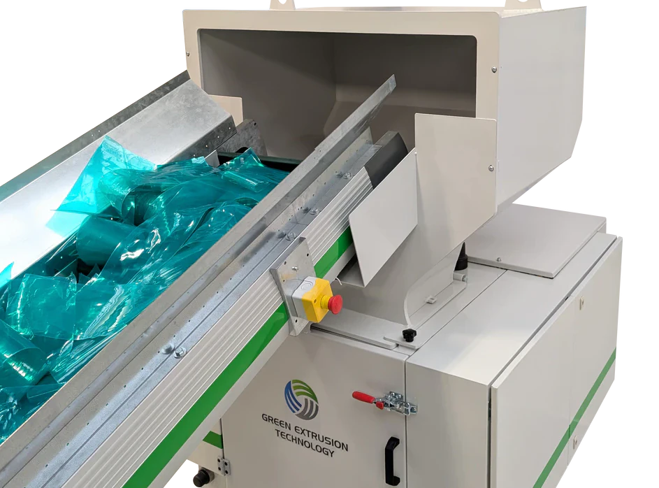 Green Extrusion granulator with cutting chamber opened for cleaning, screen access and knife maintenance